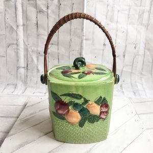 Vintage Green Majolica biscuit jar with fruit details and wicker handle